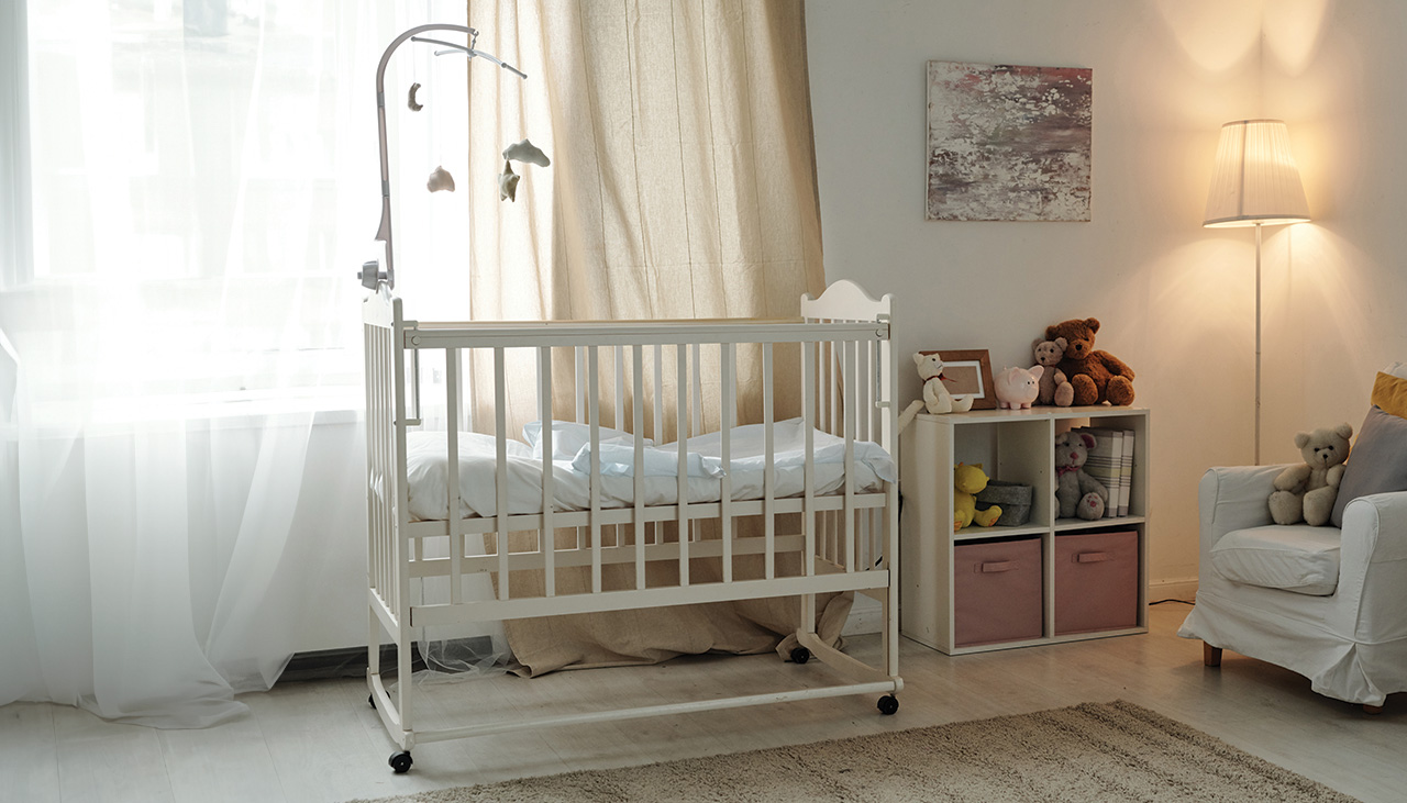 Interior-of-large-contemporary-room-of-baby-with-cradle-and-furniture