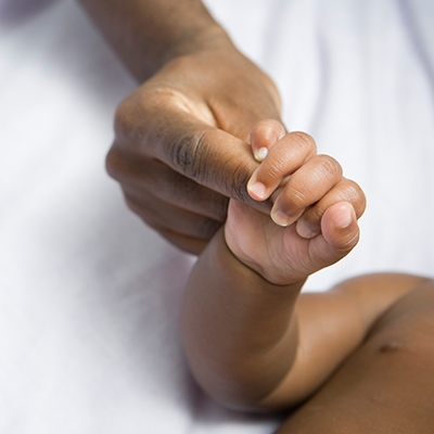 Baby and Mom holding hands