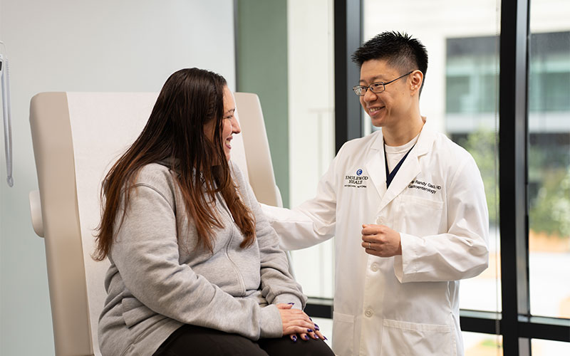 Dr. Youran Gao in consultation with patient