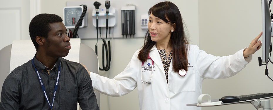 Sophia Kim, APN with patient