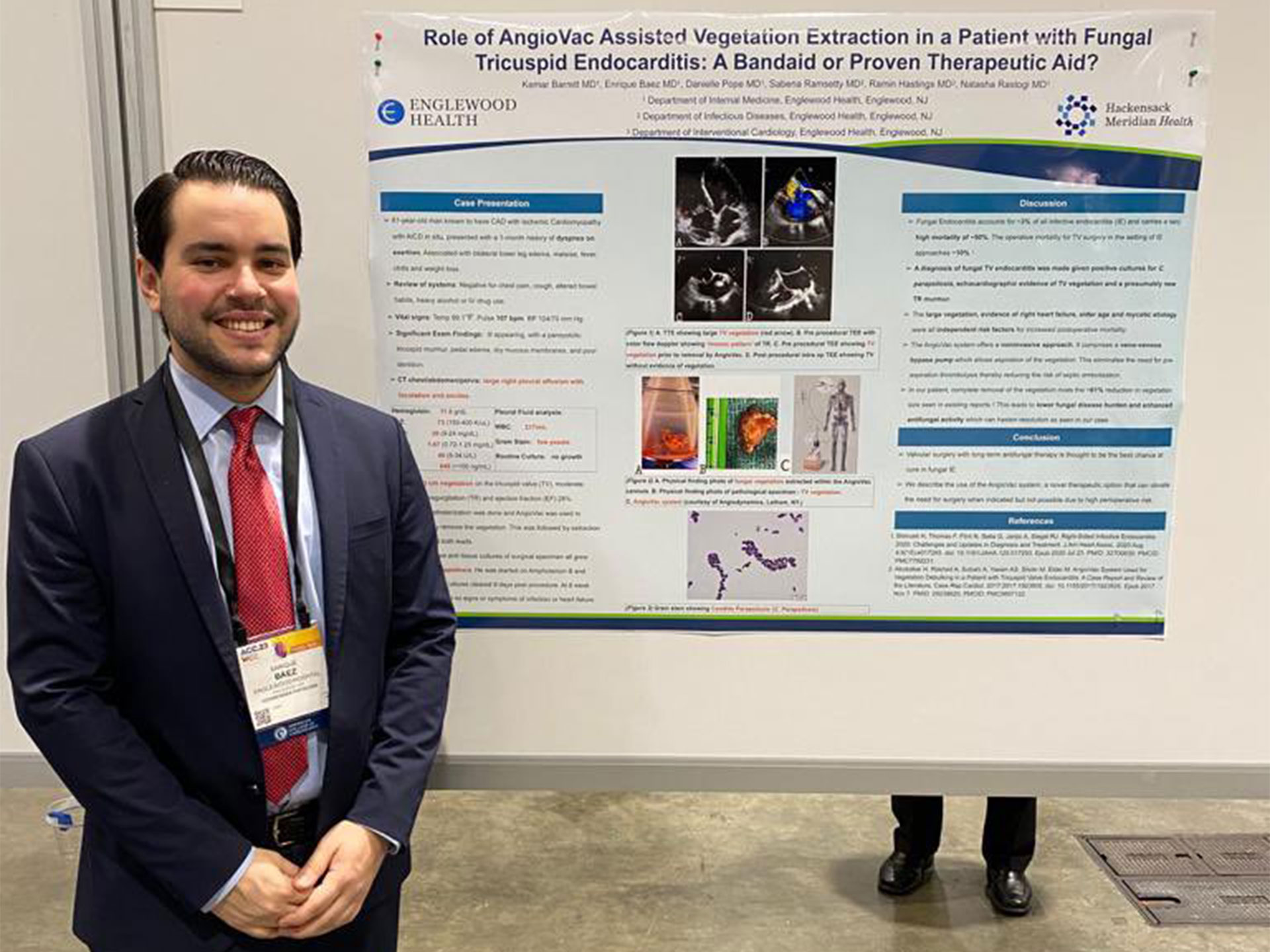 Enrique presents his poster at ACC in New Orleans.
